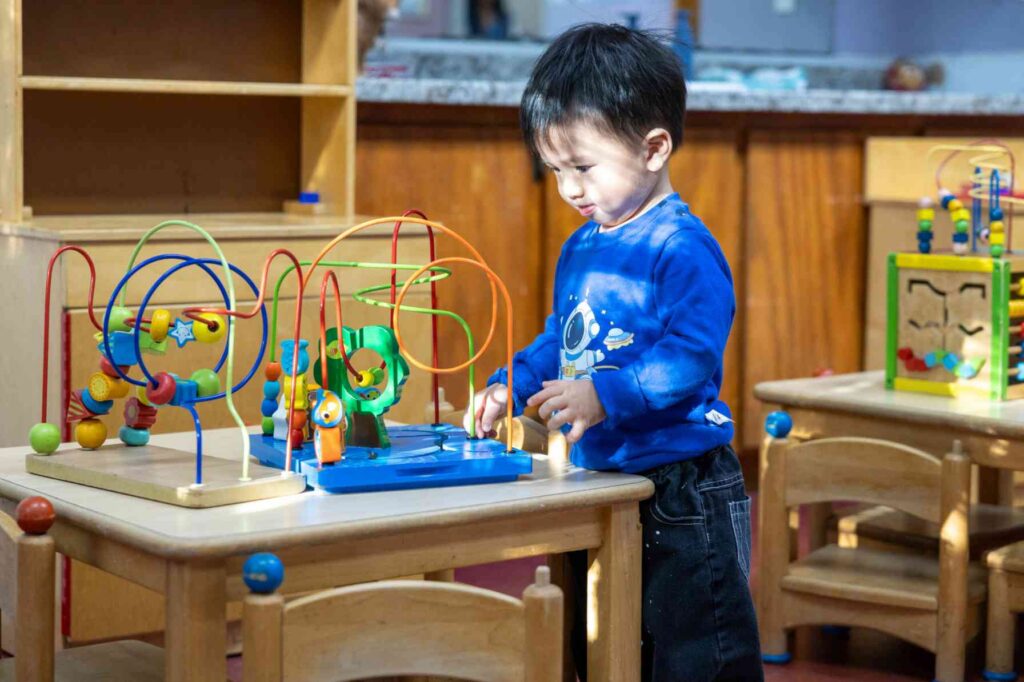Kid doing activity wearing blue cloths