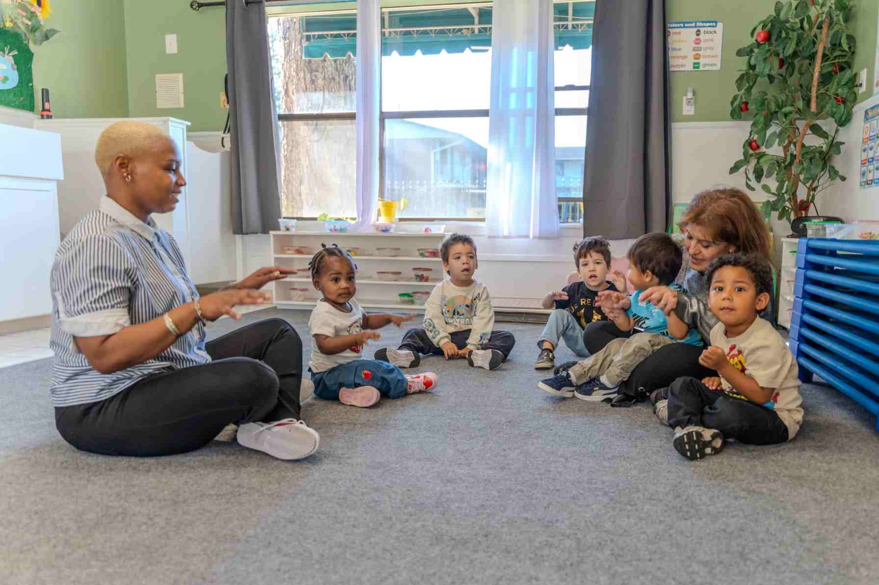 Kids sitting along with teacher